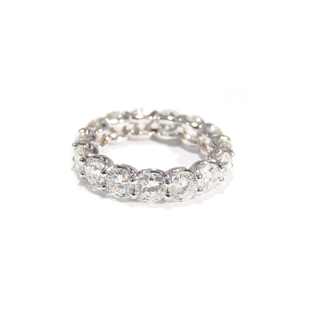 A lustrous Diamond Eternity Band. The comfortable U-Shaped design is adorned with sparkling Round Brilliant Cut Diamonds. Made For Love Jewelry. Boca Raton Florida