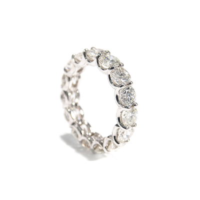 A lustrous Diamond Eternity Band. The comfortable U-Shaped design is adorned with sparkling Round Brilliant Cut Diamonds. Made For Love Jewelry. Boca Raton Florida