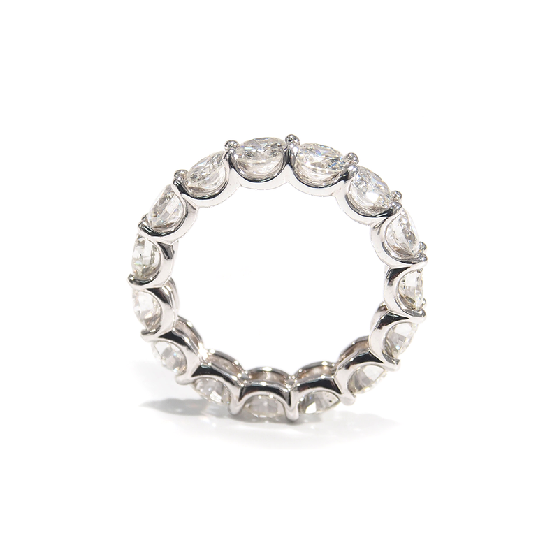 A lustrous Diamond Eternity Band. The comfortable U-Shaped design is adorned with sparkling Round Brilliant Cut Diamonds. Made For Love Jewelry. Boca Raton Florida